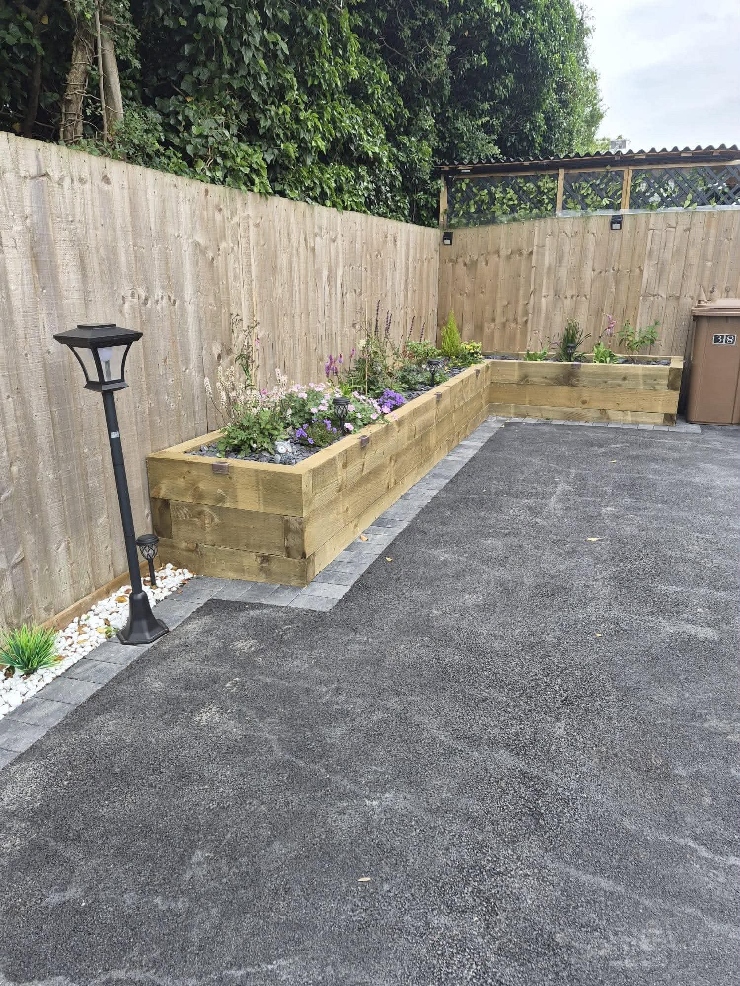 Block paving path, tarmac & raised sleeper beds — detail 3